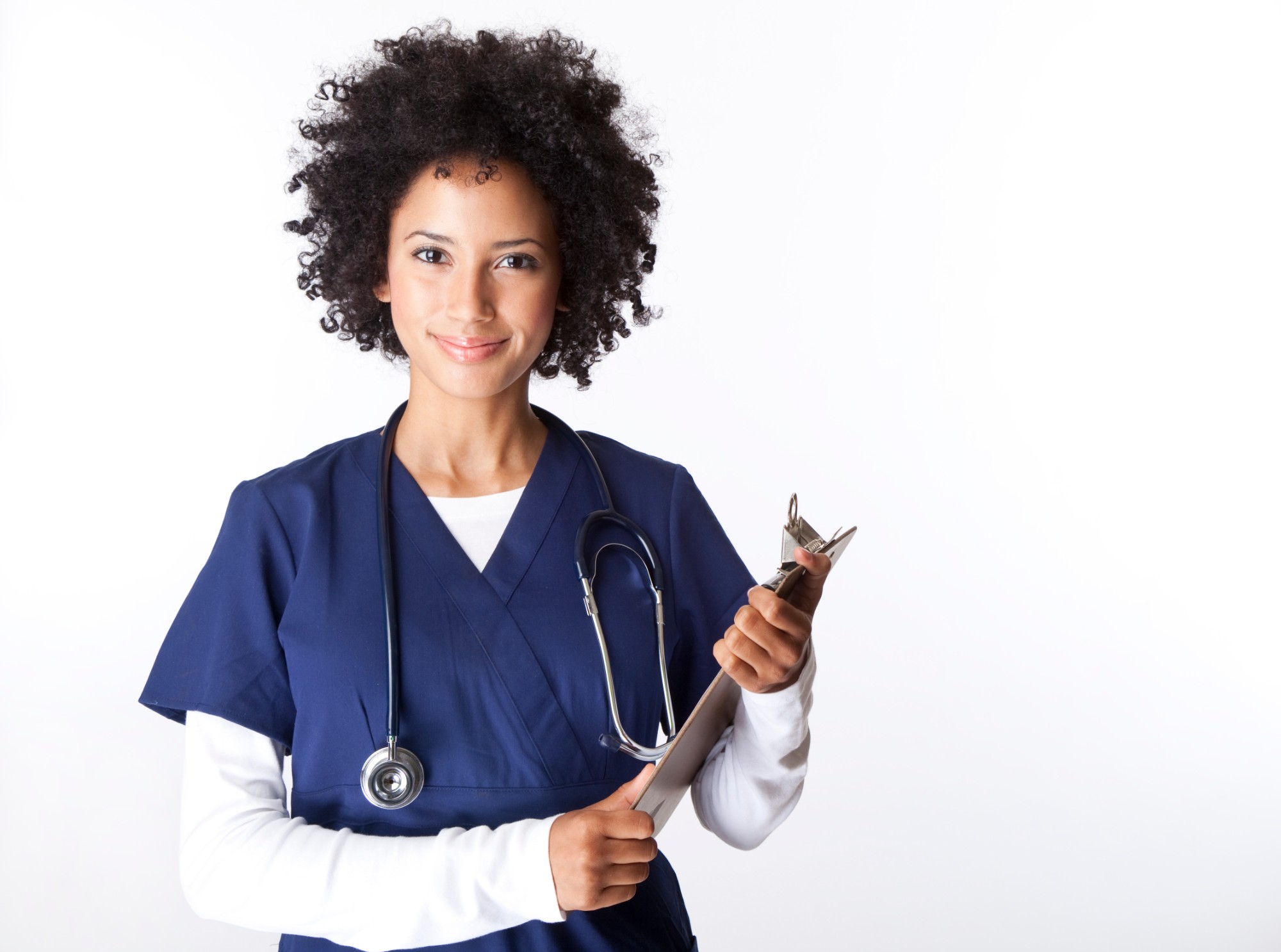 A smiling healthcare provider in scrubs holding a stethoscope and clipboard, representing the trusted care team patients build with MedMatchNet